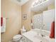 Bright bathroom featuring a white vanity and toilet plus a shower with decorative curtain at 5026 Celtic Ct, Raleigh, NC 27612