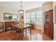 Bright dining room with hardwood floors and large window, perfect for entertaining at 5026 Celtic Ct, Raleigh, NC 27612