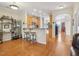 Open-concept kitchen with a breakfast bar, wood cabinets, and stainless steel appliances at 5026 Celtic Ct, Raleigh, NC 27612