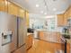 Open kitchen with stainless steel appliances, granite counters, and an open floorplan at 5026 Celtic Ct, Raleigh, NC 27612