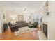 Cozy living room with a fireplace, plush seating, and natural light at 5026 Celtic Ct, Raleigh, NC 27612