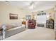 Bright living room offering carpet flooring, relaxed seating, fan, and natural light through a window at 5026 Celtic Ct, Raleigh, NC 27612