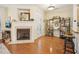 Inviting living room with a fireplace, hardwood floors, and a view to the outside at 5026 Celtic Ct, Raleigh, NC 27612
