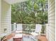 Inviting porch with white chairs and a table, perfect for relaxing and enjoying the view at 5026 Celtic Ct, Raleigh, NC 27612