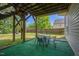 Covered patio with outdoor seating and a view of the fenced backyard at 503 Bellefont Ct, Knightdale, NC 27545