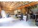Unfinished basement with exposed beams, concrete floor, and abundant storage space at 503 Bellefont Ct, Knightdale, NC 27545