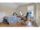 Bedroom featuring a bed, desk with computer setup, and hardwood floors at 503 Bellefont Ct, Knightdale, NC 27545