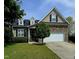 Charming two-story home featuring stone accents, a manicured lawn, and an attached two car garage at 503 Bellefont Ct, Knightdale, NC 27545