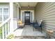 Inviting front porch with stone floor, seating, and stylish decor for a welcoming entrance to the home at 503 Bellefont Ct, Knightdale, NC 27545