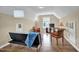 Living room with a futon, chairs, TV, and hardwood floors at 503 Bellefont Ct, Knightdale, NC 27545