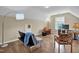 Living room with a futon, chairs, TV, and hardwood floors at 503 Bellefont Ct, Knightdale, NC 27545