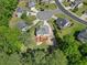 Aerial of a residential lot showing a backyard deck, play area and mature trees at 503 Mugo Pine Ct, Wendell, NC 27591