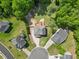 Backyard aerial featuring a deck, trampoline, and mature trees in a residential neighborhood at 503 Mugo Pine Ct, Wendell, NC 27591