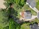 Overhead view of a backyard showcasing a wooden deck, trampoline, and a playset at 503 Mugo Pine Ct, Wendell, NC 27591