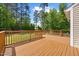 Wooden back deck overlooking a lush green backyard, providing outdoor entertainment at 503 Mugo Pine Ct, Wendell, NC 27591