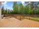Wooden back deck overlooking a lush green backyard providing outdoor entertainment at 503 Mugo Pine Ct, Wendell, NC 27591