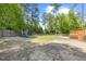 Large backyard with a play area featuring a slide and a swing set, perfect for Gathering fun at 503 Mugo Pine Ct, Wendell, NC 27591