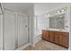 Bathroom featuring a double vanity, soaking tub, and a glass-enclosed shower at 503 Mugo Pine Ct, Wendell, NC 27591