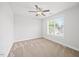 Bedroom features neutral carpet, ceiling fan, and natural light, offering a tranquil space for rest and relaxation at 503 Mugo Pine Ct, Wendell, NC 27591