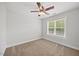 Neutral bedroom with a ceiling fan and a window with blinds, creating a serene space at 503 Mugo Pine Ct, Wendell, NC 27591