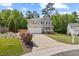 Traditional two-story home featuring a well-maintained lawn and long driveway at 503 Mugo Pine Ct, Wendell, NC 27591