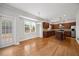 Bright kitchen features a center island, hardwood floors, and stainless steel appliances, perfect for entertaining at 503 Mugo Pine Ct, Wendell, NC 27591