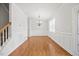 Open living room featuring hardwood floors, crown molding, and an elegant chandelier perfect for gatherings at 503 Mugo Pine Ct, Wendell, NC 27591