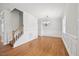 Spacious living area boasting hardwood floors, wainscoting, and staircase access at 503 Mugo Pine Ct, Wendell, NC 27591