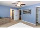 This bedroom features an open ensuite bathroom, closet, ceiling fan, and neutral colored carpet at 508 Colony Woods Dr, Chapel Hill, NC 27517