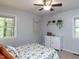 Light-filled bedroom with neutral carpet, decor, and a large window providing natural light at 508 Colony Woods Dr, Chapel Hill, NC 27517