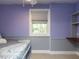 Comfortable bedroom featuring a built-in desk and shelving, perfect for work or study at 508 Colony Woods Dr, Chapel Hill, NC 27517