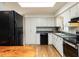 Functional kitchen featuring white cabinetry, modern appliances, and plenty of natural light from the window at 508 Colony Woods Dr, Chapel Hill, NC 27517