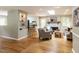 Cozy living area featuring a brick fireplace, skylight, hardwood floors, and neutral decor at 508 Colony Woods Dr, Chapel Hill, NC 27517