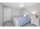 Bedroom with a ceiling fan, window, and light neutral decor at 509 National Dr, Clayton, NC 27520