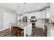 Bright kitchen with granite countertops, stainless steel appliances, and a large island with seating at 509 National Dr, Clayton, NC 27520