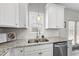 Bright kitchen with stainless steel appliances, granite countertops, and a double sink at 509 National Dr, Clayton, NC 27520