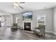 Comfortable living room with fireplace, flatscreen TV, and stylish seating on wood-look flooring at 509 National Dr, Clayton, NC 27520