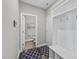 Bright mudroom with built-in storage and access to a convenient half-bathroom at 509 National Dr, Clayton, NC 27520