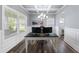 Bright home office with coffered ceiling, modern light fixture, and wood-look flooring at 509 National Dr, Clayton, NC 27520