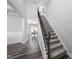 Entryway staircase featuring carpeted steps and dark metal spindles at 509 National Dr, Clayton, NC 27520