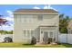 Two-story home featuring a patio with outdoor furniture, barbeque and fenced-in backyard at 5204 Nautical Ln, Raleigh, NC 27610