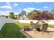 Backyard featuring patio with outdoor furniture, grill, and well maintained grass at 5204 Nautical Ln, Raleigh, NC 27610