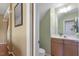 Bathroom featuring a vanity with storage, a mirror, and fixtures at 5204 Nautical Ln, Raleigh, NC 27610