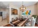 Comfortable dining area with modern chairs, a wooden table, and a view into the kitchen at 5204 Nautical Ln, Raleigh, NC 27610