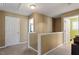 Upper hallway with neutral walls and carpet, connecting to various rooms at 5204 Nautical Ln, Raleigh, NC 27610