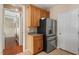 Open kitchen space with stainless steel refrigerator and functional cabinetry for ample storage solutions at 5204 Nautical Ln, Raleigh, NC 27610