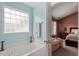 A view of the bathtub and window in a main bathroom at 5204 Nautical Ln, Raleigh, NC 27610
