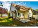 Backyard patio area with grass, exterior elevation, grill, and yard with landscaping at 5515 S Roxboro St # 23, Durham, NC 27713
