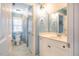 Clean bathroom with white cabinets, a toilet, and a tiled shower behind a curtain at 5515 S Roxboro St # 23, Durham, NC 27713
