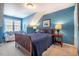 Comfortable bedroom with a full bed, natural light, and cozy atmosphere at 5515 S Roxboro St # 23, Durham, NC 27713